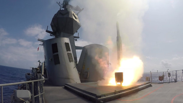 HMAS Toowoomba fires a missile during exercises in the Pacific in 2018.