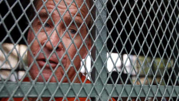 Australian filmmaker James Ricketson on his way to court in Cambodia on Thursday.