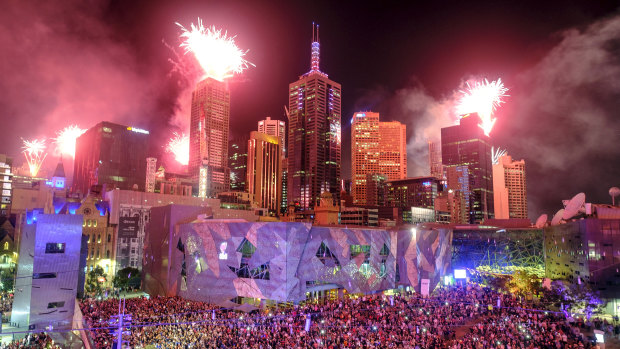 Federation Square lights up.