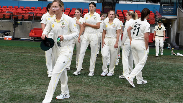 Meg Lanning leads Australia out on to the ground.