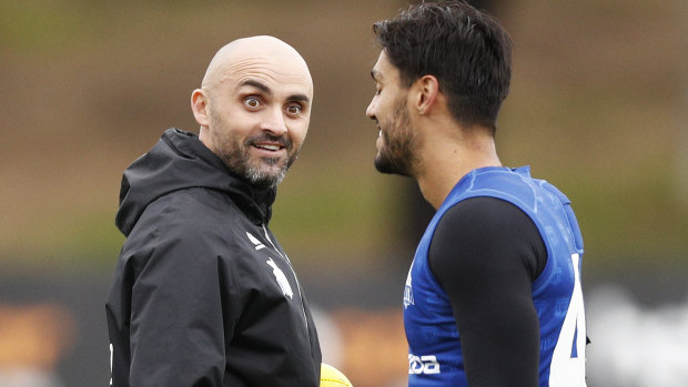 North Melbourne caretaker coach Rhyce Shaw (left) is tipped to land the job, but he says he "can't be confident".