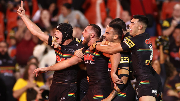 The Panthers celebrate after Kurt Capewell’s try inside the final two minutes.