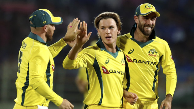 Confidence back: Adam Zampa (centre) says Glenn Maxwell (right) was a big help in getting him back on track.