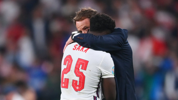 England manager Gareth Southgate consoles Bukayo Saka after the defeat to Italy.