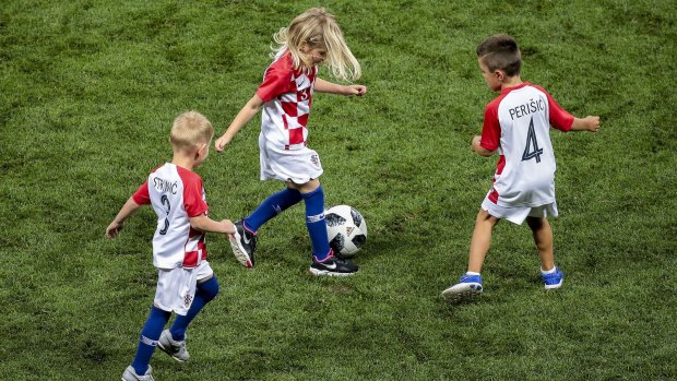Children of the Croatian players celebrate victory at the end of the match against England 