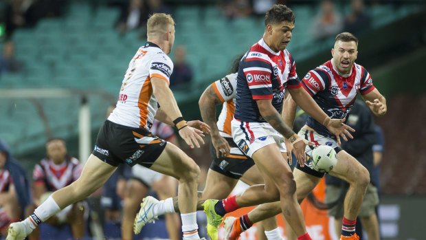 Deft: Mitchell kicks infield for Luke Keary with James Tedesco in pursuit at the SCG.