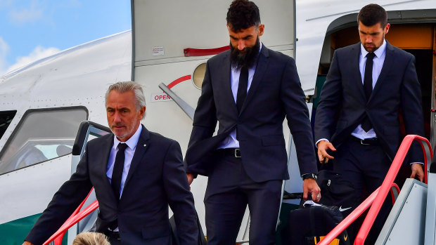 The Socceroos touch down: Coach Bert Van Marwijk and players Mile Jedinak and Mat Ryan disembark at Kazan airport.