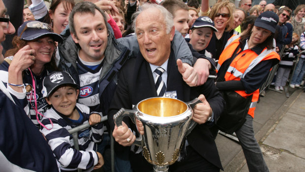 Frank Costa is mobbed by fans in 2007 after Geelong’s premiership.