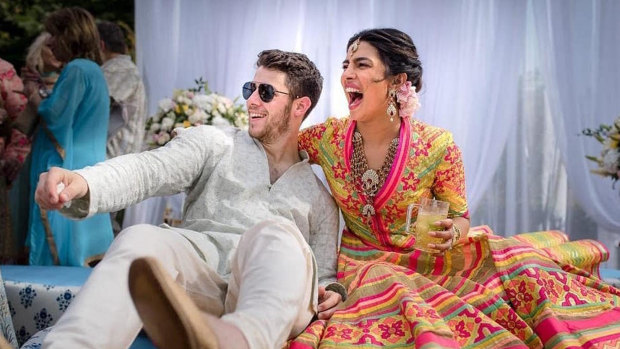 Priyanka Chopra and Nick Jonas celebrate during their mehendi ceremony, a day before their wedding.