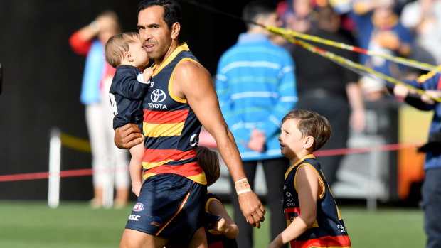 Junior Eds: Crows' milestone man runs on the Adelaide Oval with his children before the match against the Suns.