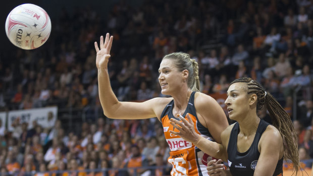 Caitlin Bassett takes the lead over Magpie Geva Mentor in the Giants eight-point Super Netball win on the weekend.