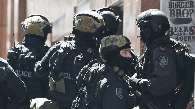 Special operations police assemble a block away from the siege in Sydney’s Martin Place.