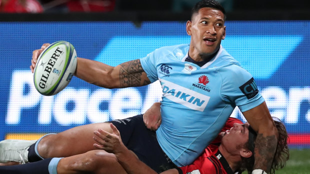 In form: Israel Folau scores a try for the NSW Waratahs against the Crusaders in Christchurch on Saturday.