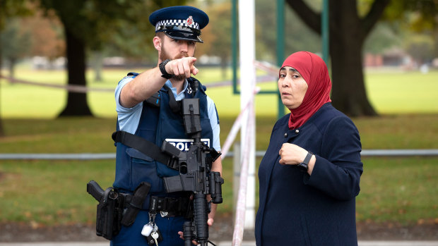 New Zealand police patrol the scene of last week's Christchurch massacre.