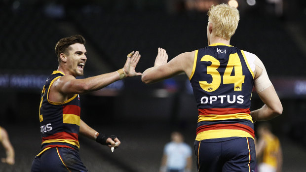 Ben Keays and Elliott Himmelberg celebrate a Crows goal.