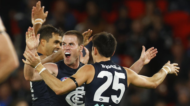 Carlton’s Matthew Owies celebrates a goal with teammates including Jack Martin and Zac Fisher.