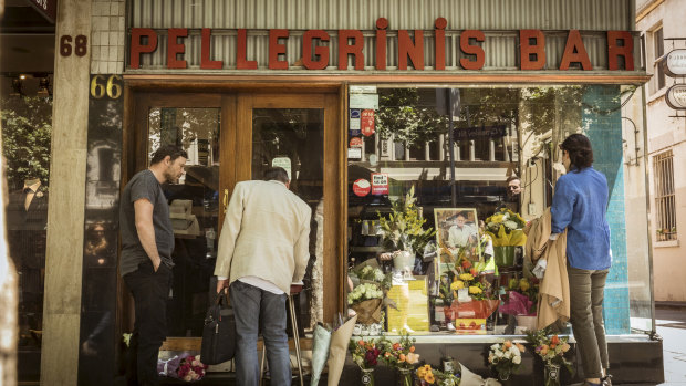 Mourners pay their respects to the co-owner of Pellegrini's, Sisto Malaspina,  after he was stabbed in the Bourke Street incident on Friday. 