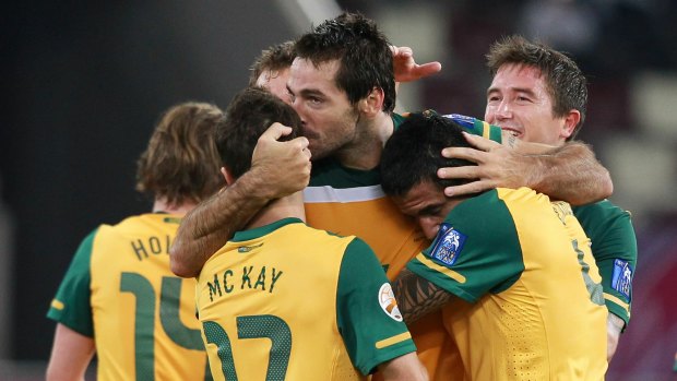 Six appeal: Sasa Ognenovski celebrates after scoring one of Australia's six goals against Uzbekistan in the 2011 Asian Cup semi-final.
