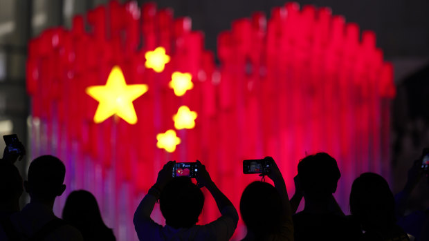 An installation depicting a heart shape Chinese national flag ahead of the 70th celebrations.