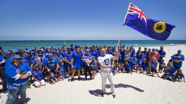 Billionaire Andrew Forrest declaring the Western Force saved in Cottesloe on November 20.