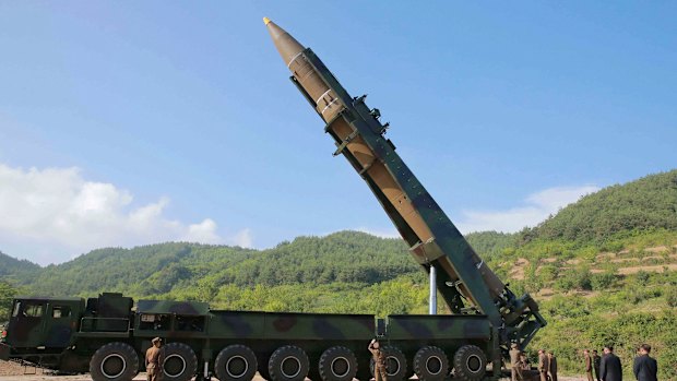 North Korean leader Kim Jong-un, second from right, inspects the preparation of the launch of a Hwasong-14 intercontinental ballistic missile in North Korea's northwest. 