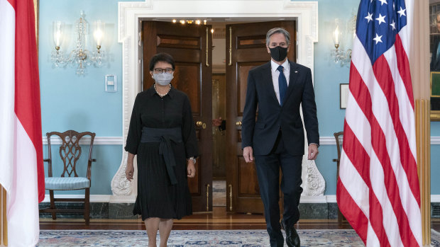 Secretary of State Antony Blinken, right, accompanied by Indonesian Foreign Minister Retno Marsudi, walks to meet the press after a bilateral meeting at the State Department in Washington.