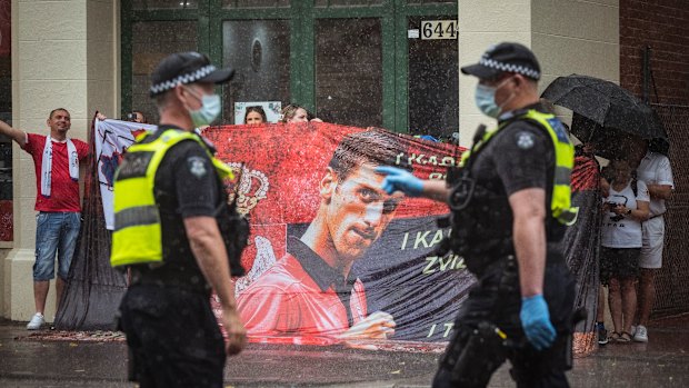 Novak Djokovic supporters protest   outside the Park Hotel where he is being held by Border Security, along with refugees in detention. 