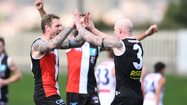 Tim Membrey of the Saints celebrates a goal with teammates. 