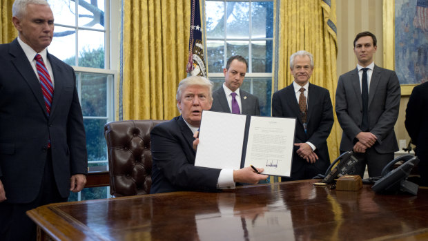 Donald Trump holds his executive order to withdraw the US from the Trans-Pacific Partnership in January last year, ending the US's decades-old tilt toward free-trade agreements.