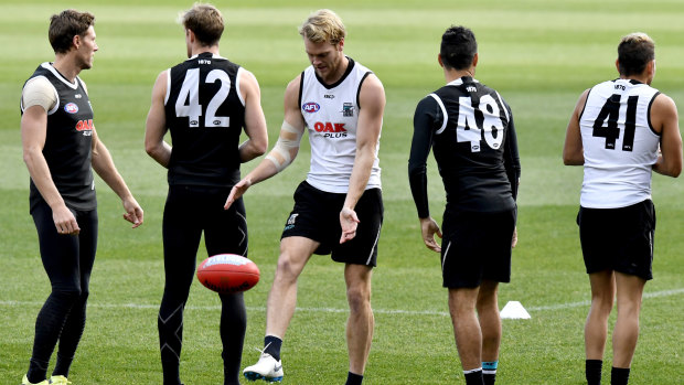 Not facing his Demons: Port Adelaide's Jack Watts (centre) during training this week.