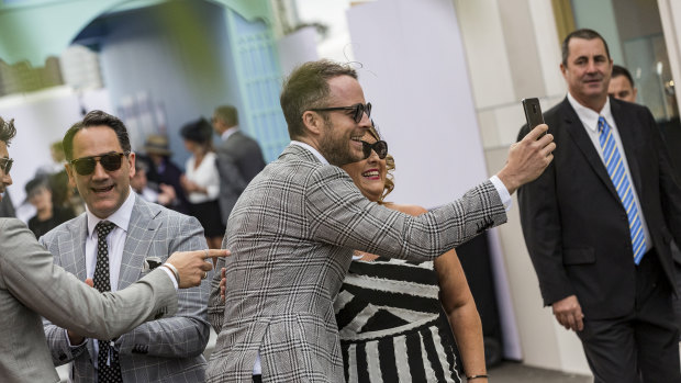 Hamish Blake stops for a selfie  in The Birdcage at the 2018 Derby.