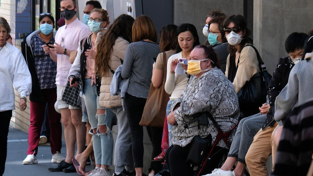 People wait outside a coronavirus screening clinic this week.