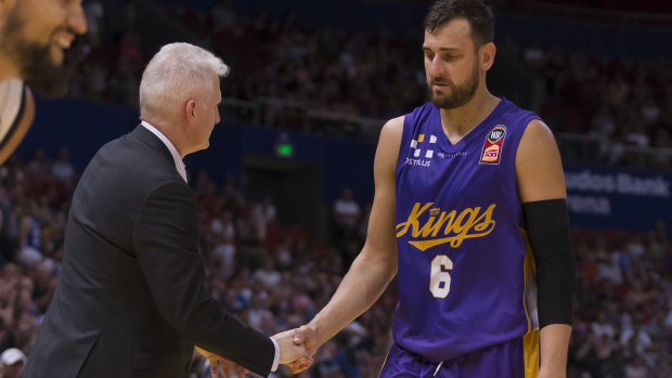 Sad end:  Andrew Gaze and Andrew Bogut shake hands near full-time of the play-off loss to Melbourne.