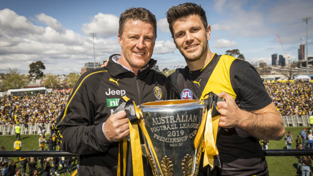 Damien Hardwick and Trent Cotchin with the premiership cup on Sunday.
