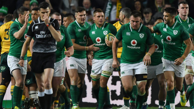 Ireland's CJ Stander (centre) celebrates with his teammates after scoring a try.