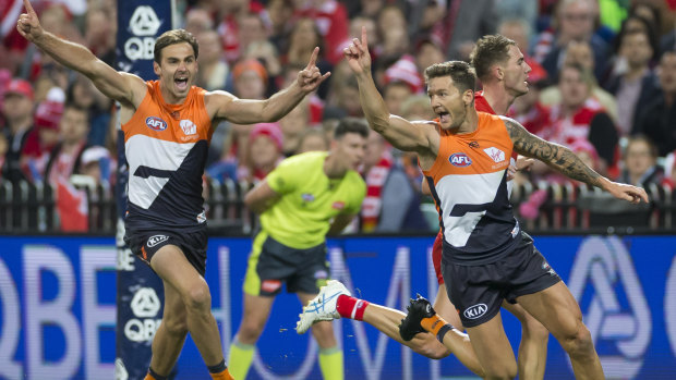 Bragging rights: Daniel Lloyd of the Giants celebrates after kicking a goal against their arch rival at the SCG.