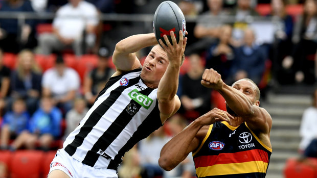 Collingwood's Ben Crocker takes a mark during the AFLX series.