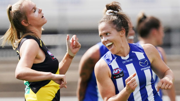 Slotted: Roos' Emma Kearney celebrates adding another goal to her tally agains the Tigers.
