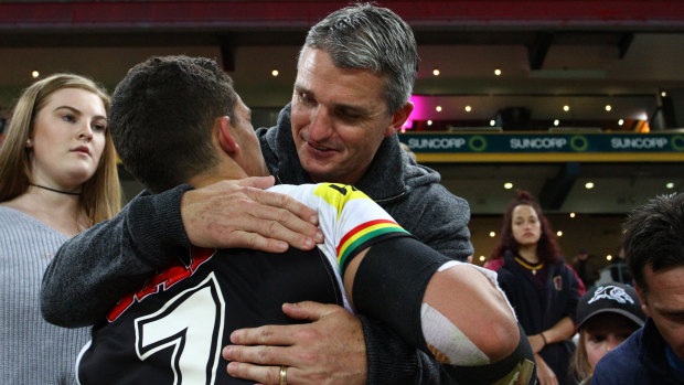 Tight: Ivan Cleary gives Nathan a hug after a Panthers game last season.