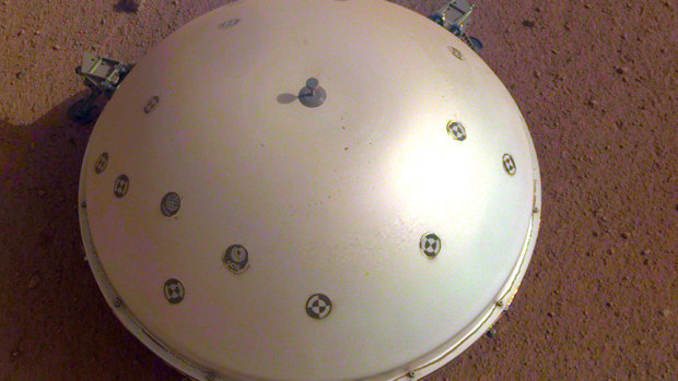 The InSight lander's domed wind and thermal shield which covers a seismometer.