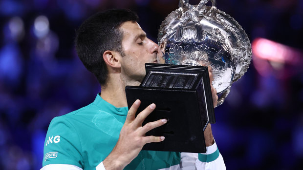 Novak Djokovic with the 2021 Australian Open trophy, his ninth Melbourne triumph.