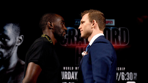 Close quarters: Terence Crawford and Jeff Horn face off at the weigh-in ahead of their fight at the MGM Grand.