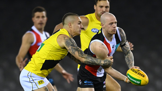 Dustin Martin, left, tackles Zak Jones, right, during the Tigers’ round four loss to St Kilda last year.