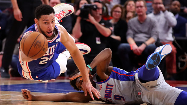 Ben Simmons scrambles for the ball after driving past Langston Galloway of the Detroit Pistons at Little Caesars Arena in Detroit.