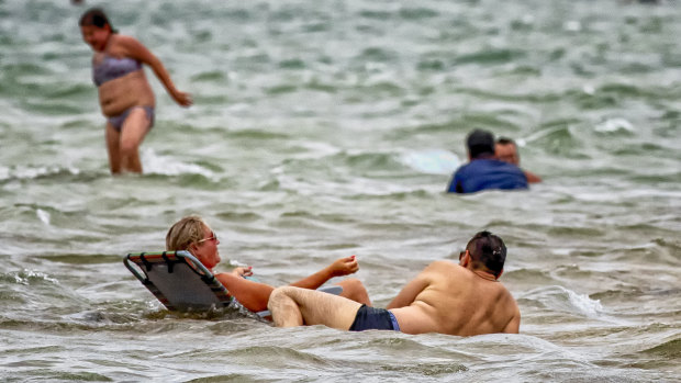 Seeking reprieve from the heat at Port Melbourne beach.