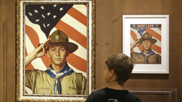 Andrew Garrison, 11, of Salt Lake City, looks at one of 23 original, Boy Scout-themed Norman Rockwell paintings to celebrate the 100-year relationship between Scouting and the Mormon church. 