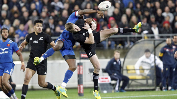 Controversial: All Black Jordie Barrett, right, and France's Benjamin Fall collide in the incident which saw the Frenchman sent off. 