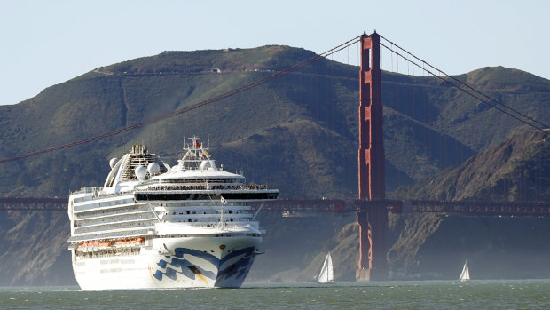 The Grand Princess cruise ship passes the Golden Gate Bridge as it arrives.