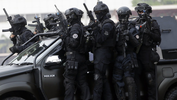 Indonesian police and military special forces take part in an anti-terrorism drill ahead of the 2018 Asian Games in Jakarta.