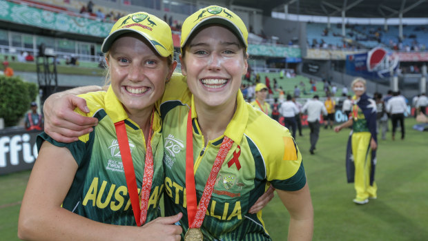 Ellyse Perry and Alyssa Healy celebrate after the team wins against England in the final of the ICC World Twenty20 in Bangladesh in 2014.
